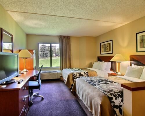 Pillowtop beds, desk, blackout drapes, iron/ironing board