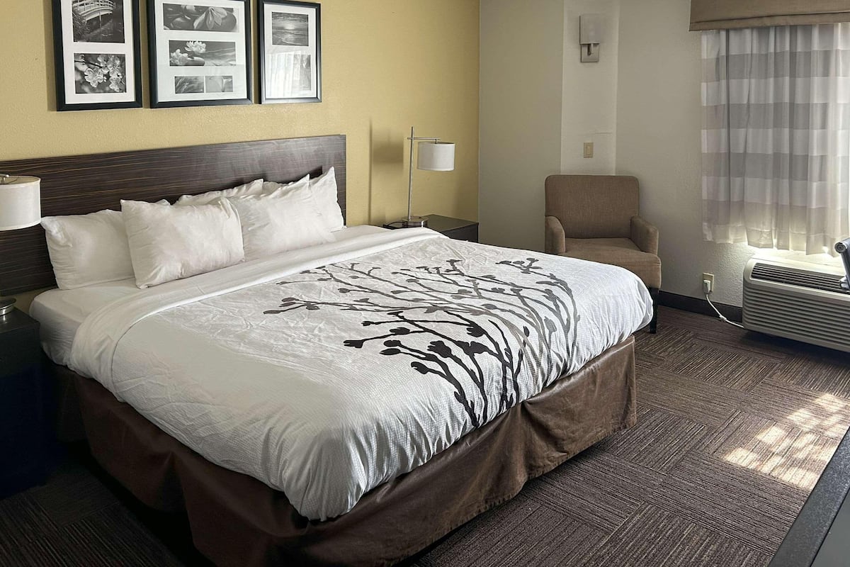 Desk, iron/ironing board, bed sheets