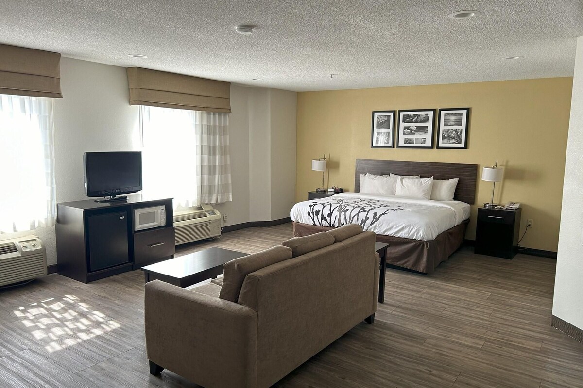 Desk, iron/ironing board, bed sheets
