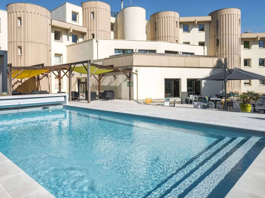 Outdoor pool, open 9:00 AM to 8:00 PM, pool umbrellas, pool loungers