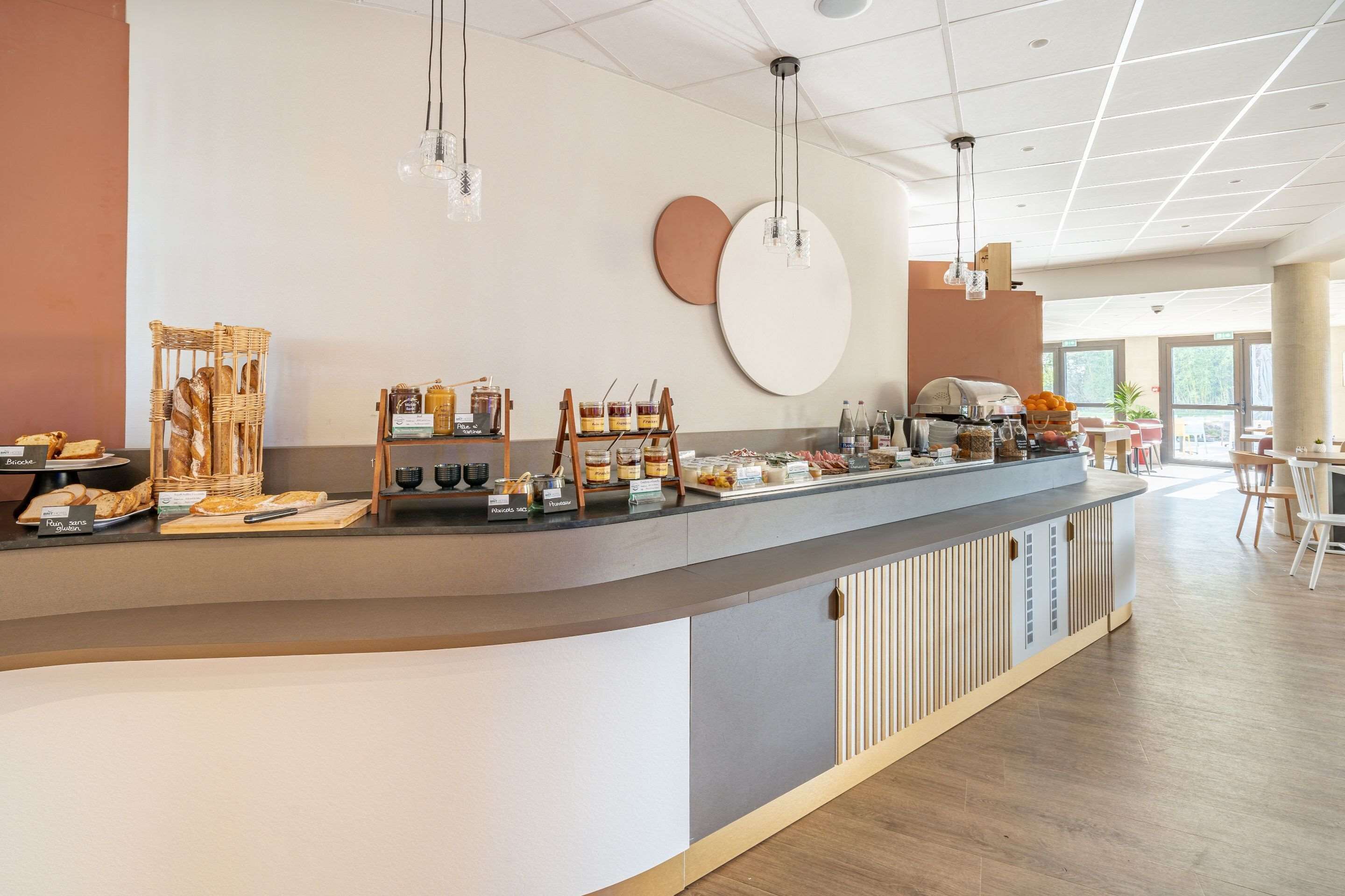 A modern breakfast bar with a variety of food items and a clean, minimalist design.