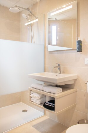 Shower, free toiletries, hair dryer, towels