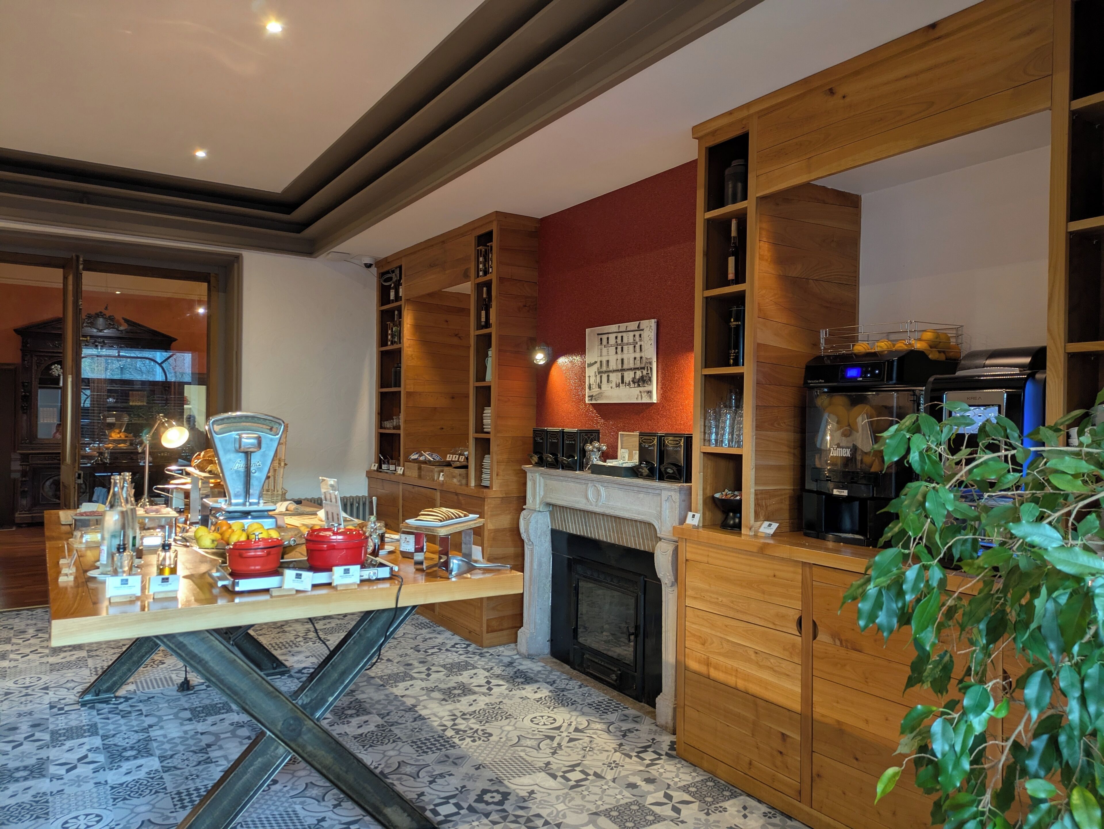 A modern kitchen with wooden cabinetry, a built-in stove, and a variety of kitchen appliances.