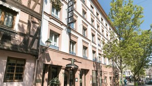 A historic building with a sign reading "HOTEL" and a traditional facade with multiple windows and balconies. - Hôtel de l'Europe by Happyculture (Strasbourg)