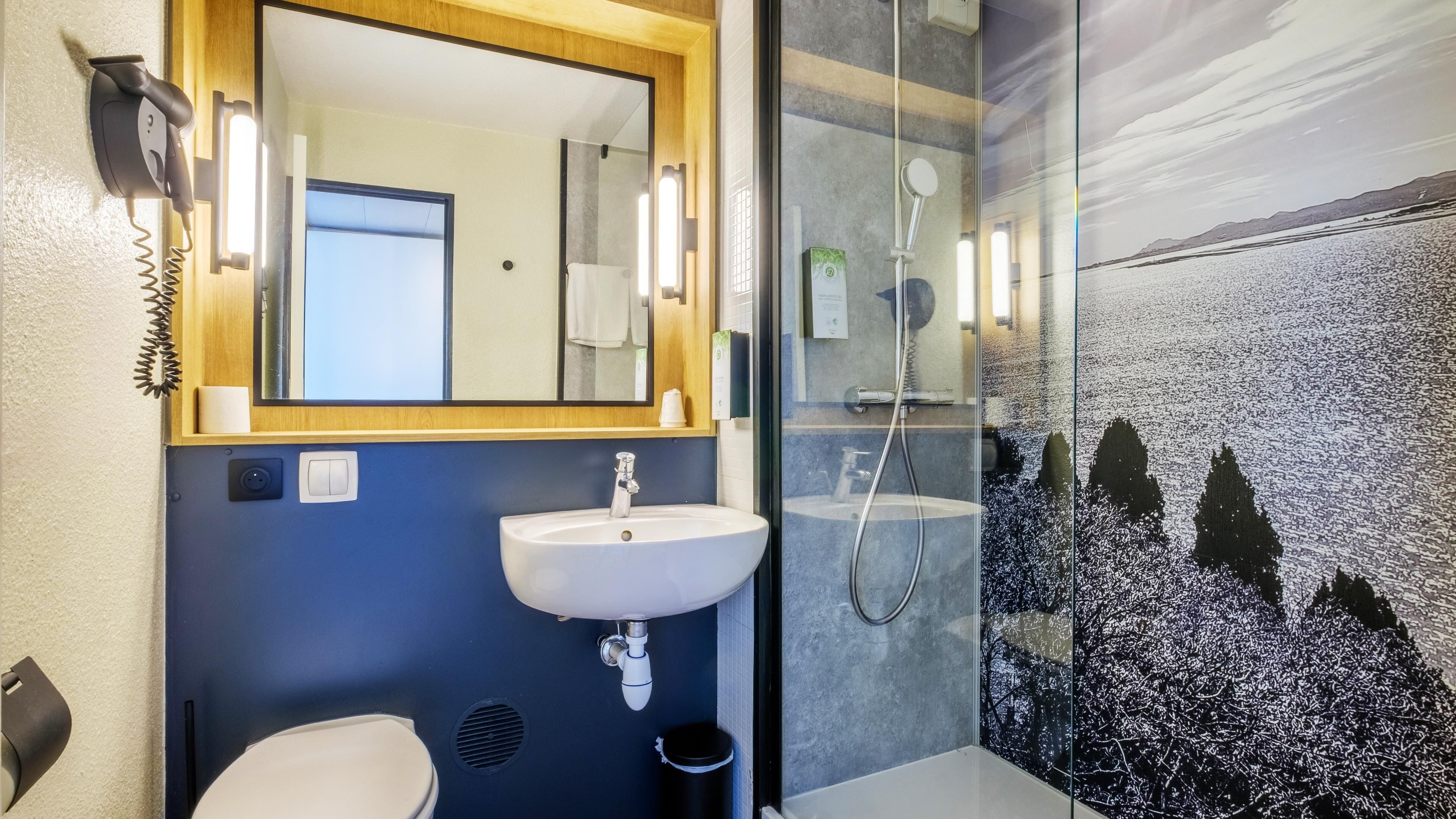 rainfall showerhead, eco-friendly toiletries, hair dryer, towels