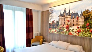 A hotel room with a large bed, a chair, a window with curtains, and a wall mural of a castle. - Kyriad - Tours Centre (Tours)