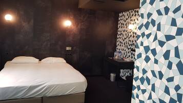 Deluxe Room | Down comforters, memory foam beds, individually decorated