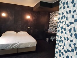 Deluxe Room | Down comforters, memory foam beds, individually decorated