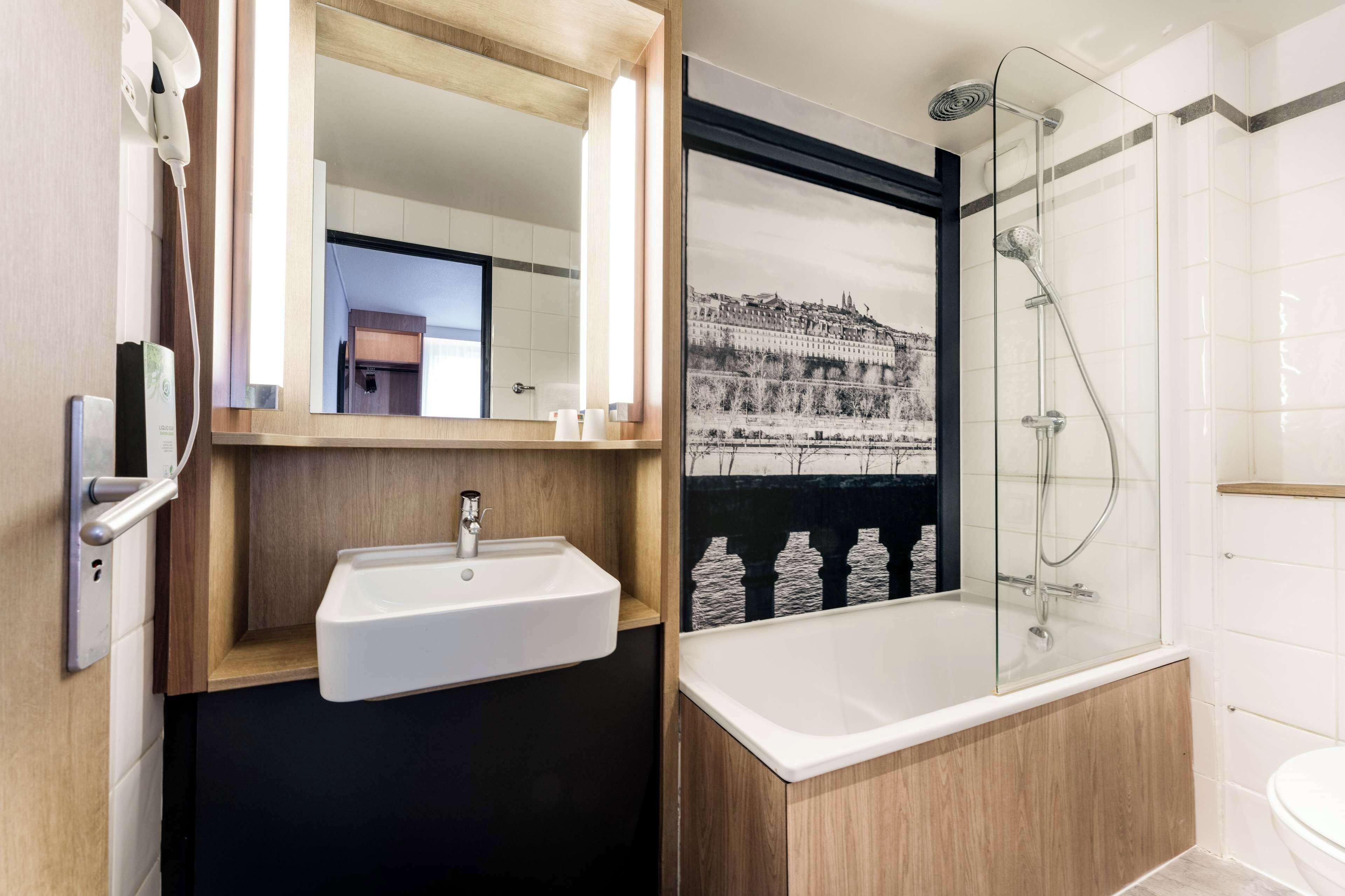 premium room, 1 queen bed | bathroom | eco-friendly toiletries, hair dryer, towels