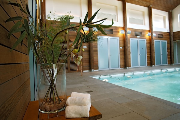 Indoor pool, open 9:00 AM to 9:00 PM, pool umbrellas, sun loungers