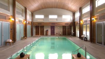 Indoor pool, open 9:00 AM to 9:00 PM, pool umbrellas, pool loungers