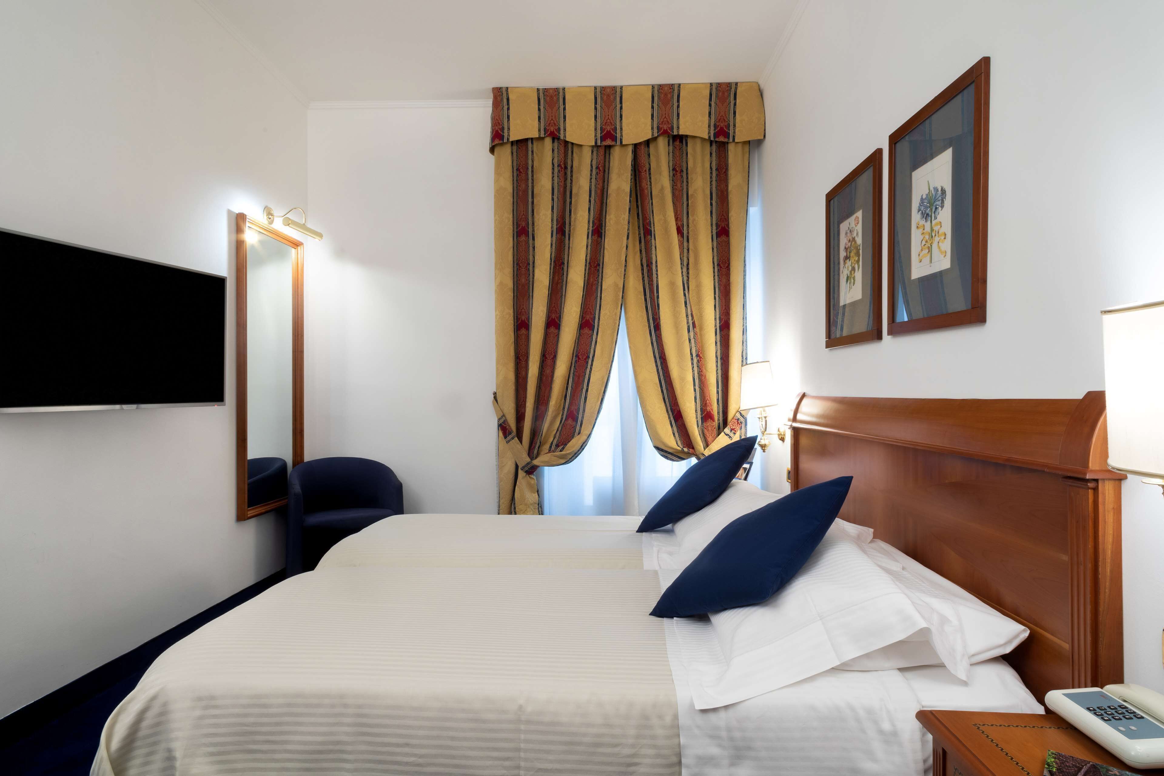 Hypo-allergenic bedding, minibar, in-room safe, desk