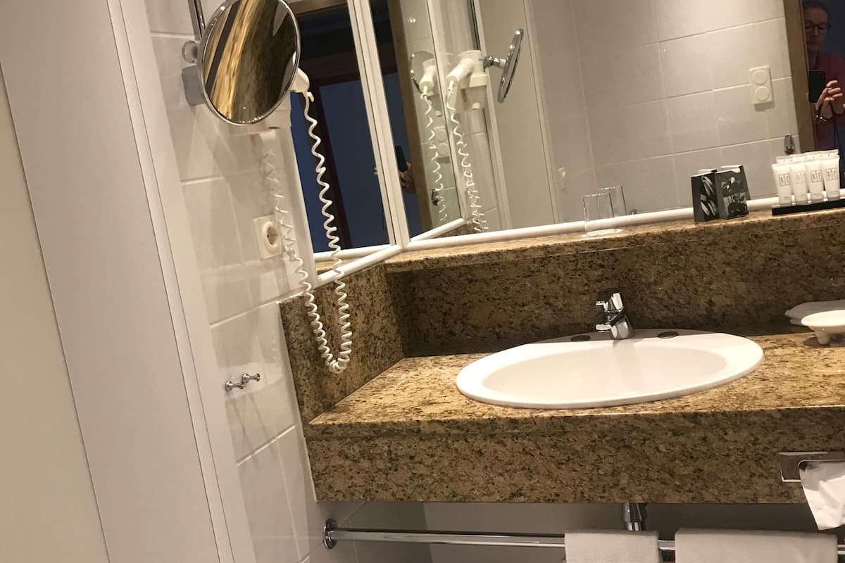 first class single room | bathroom | free toiletries, hair dryer, bathrobes, slippers