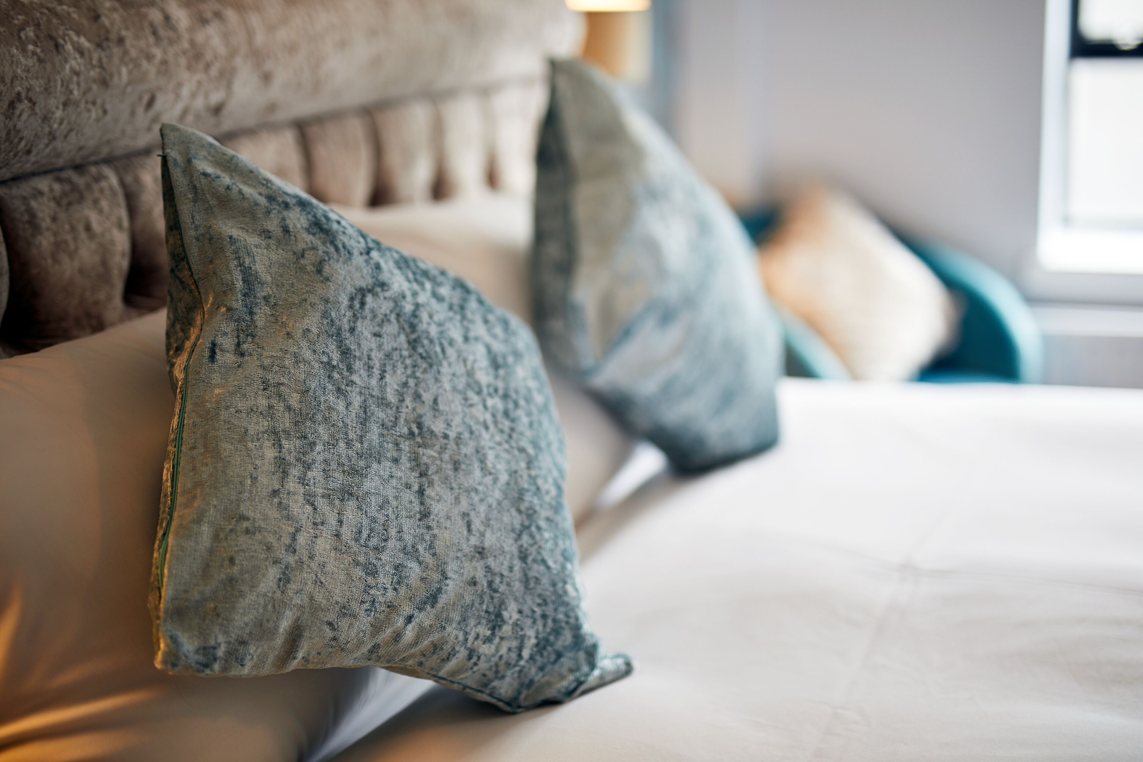 A bed with two pillows and a headboard.