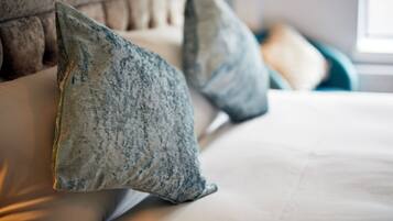 A bed with two pillows and a headboard.
