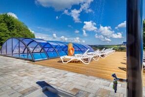 Seasonal outdoor pool, open 8:00 AM to 10:00 PM, pool umbrellas