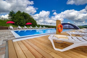 Seasonal outdoor pool, open 8:00 AM to 10:00 PM, pool umbrellas