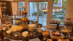 A buffet table with various food items and dishes. - The Keadeen Hotel (Newbridge)