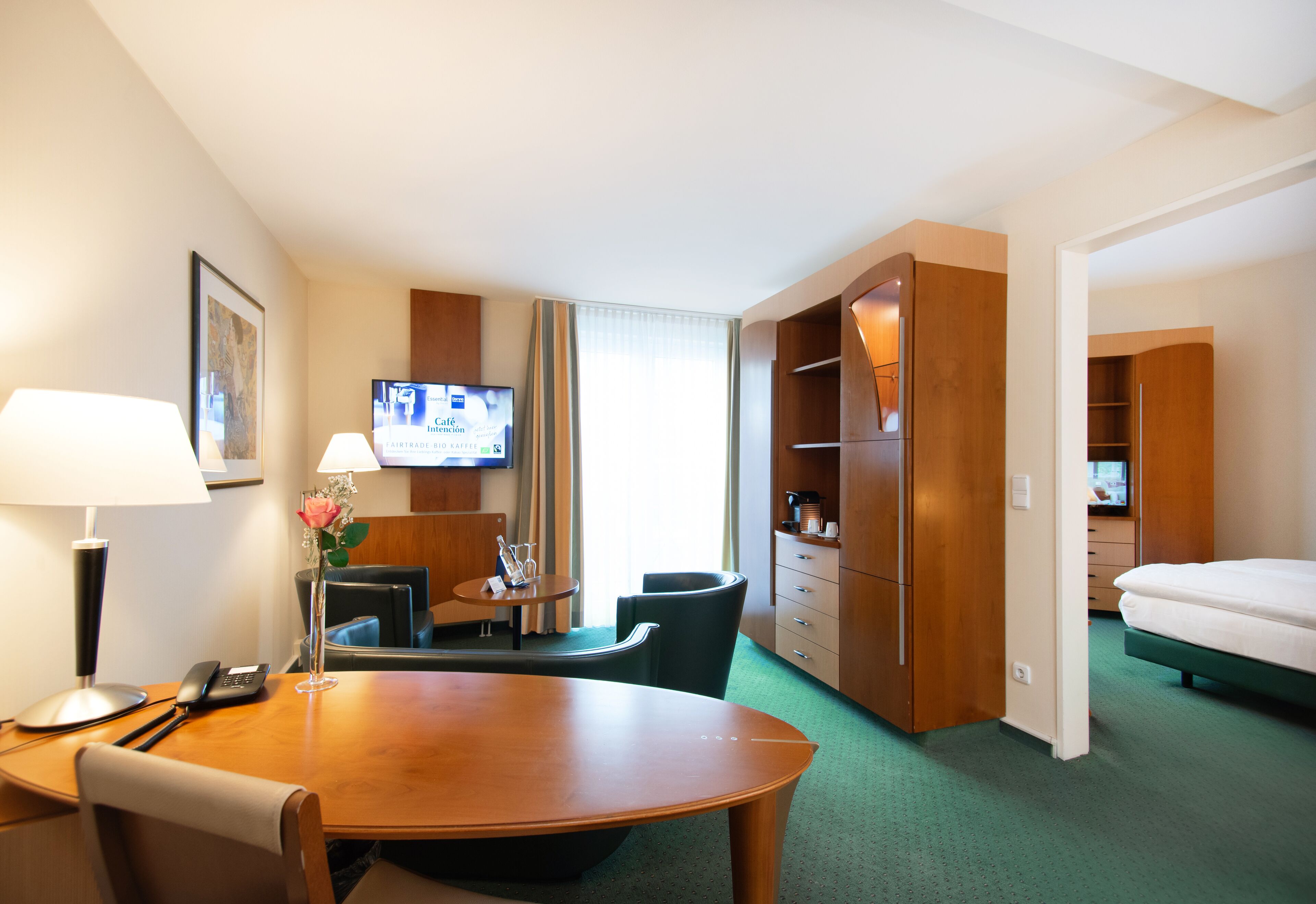 junior suite | living area | 26-inch flat-screen tv with satellite channels, tv