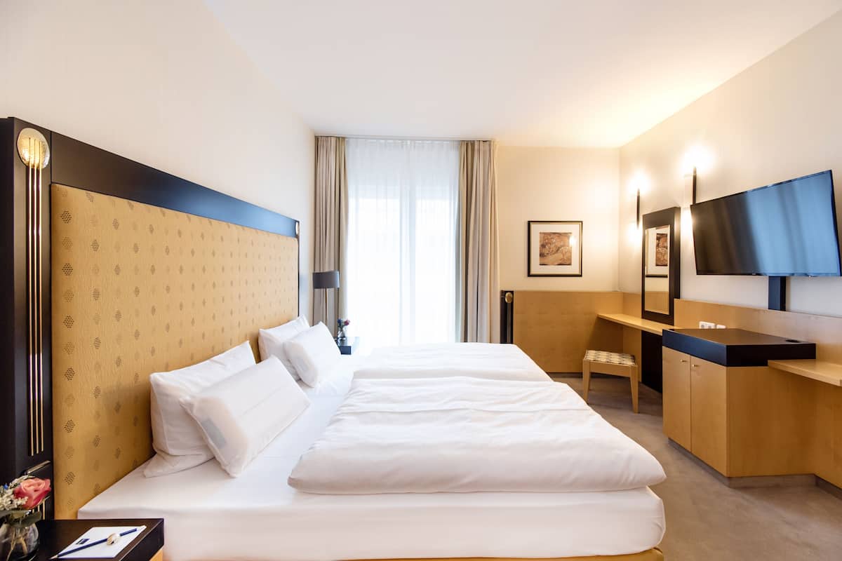 deluxe suite | 1 bedroom, select comfort beds, in-room safe, desk