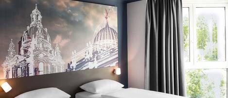 Blackout drapes, soundproofing, free WiFi, bed sheets
