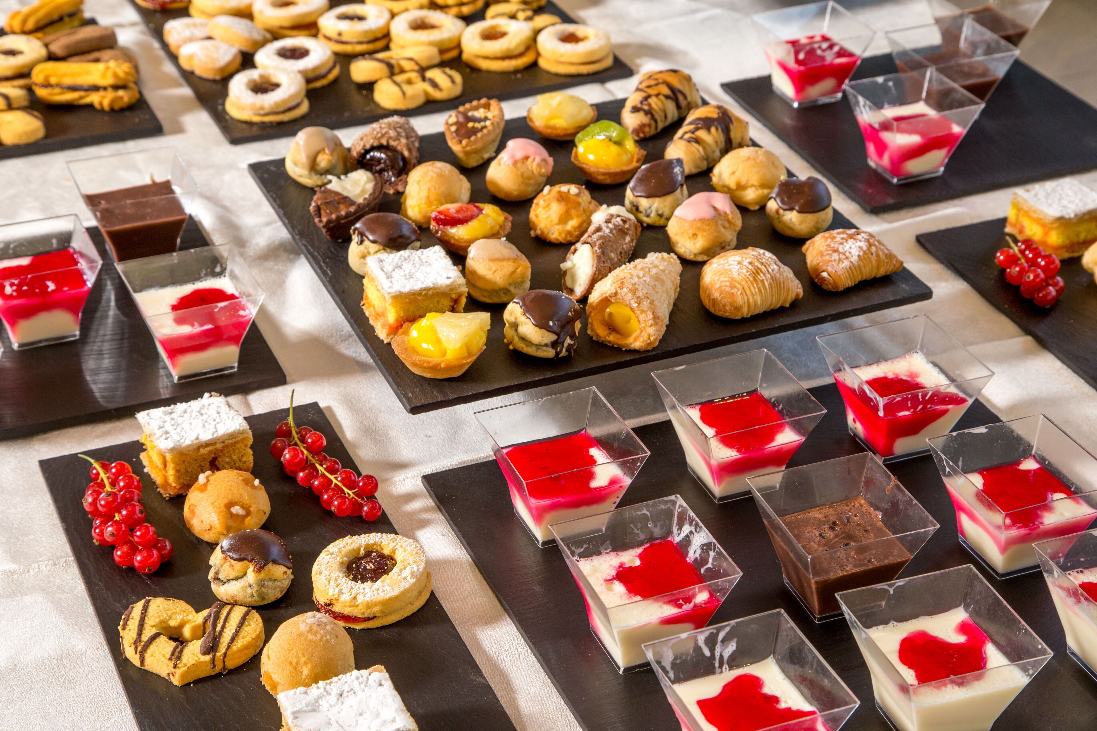 A variety of desserts and pastries arranged on a table.