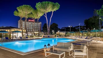 Seasonal outdoor pool, open 9:30 AM to 6:30 PM, pool umbrellas