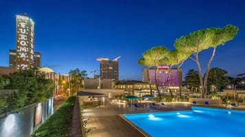 Seasonal outdoor pool, open 9:30 AM to 6:30 PM, pool umbrellas