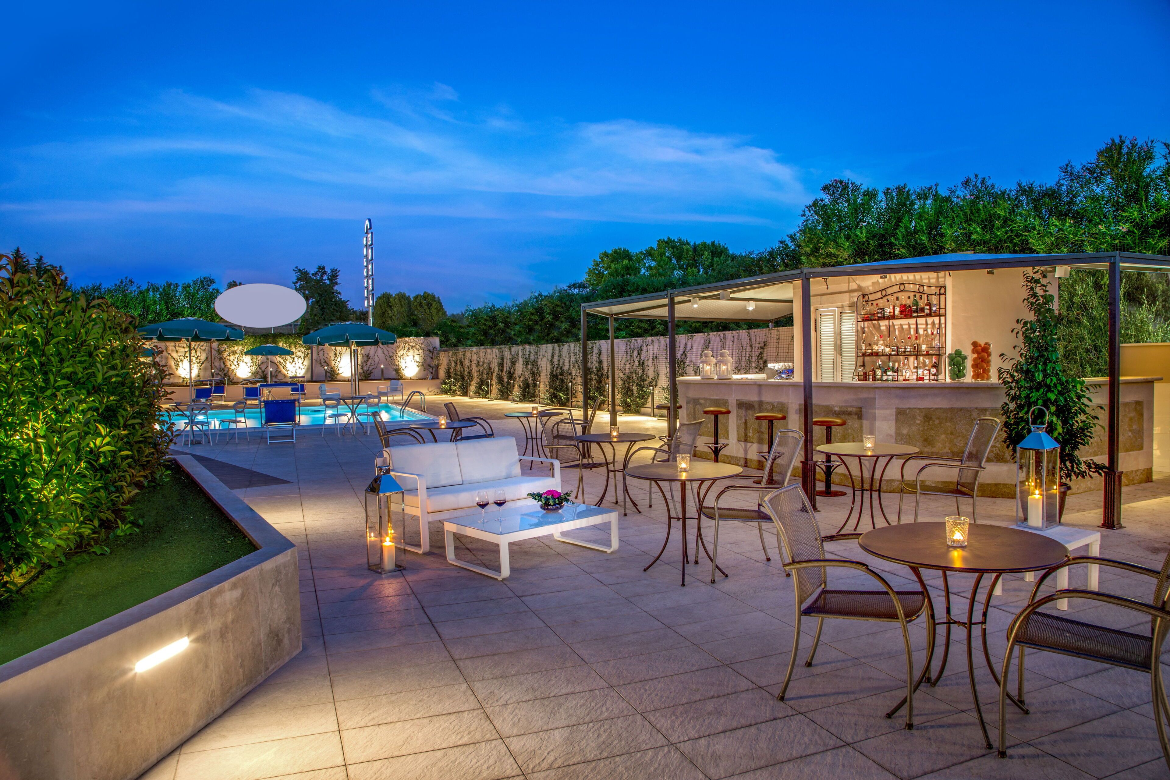 Seasonal outdoor pool, open 9:30 AM to 6:30 PM, pool umbrellas