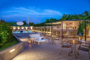 Seasonal outdoor pool, open 9:30 AM to 6:30 PM, pool umbrellas