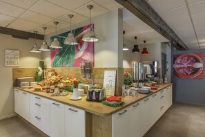 A breakfast bar with various food items, a coffee machine, and a sign that says "Enjoy Today". - Hôtel Cristol (Avignon)