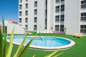 Seasonal outdoor pool, open 11:00 AM to 7:00 PM, pool loungers