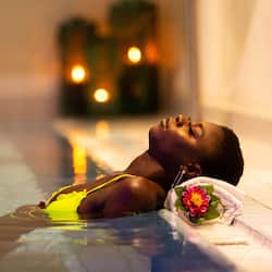 Relax in a serene spa setting with a soothing bathtub and calming ambiance.