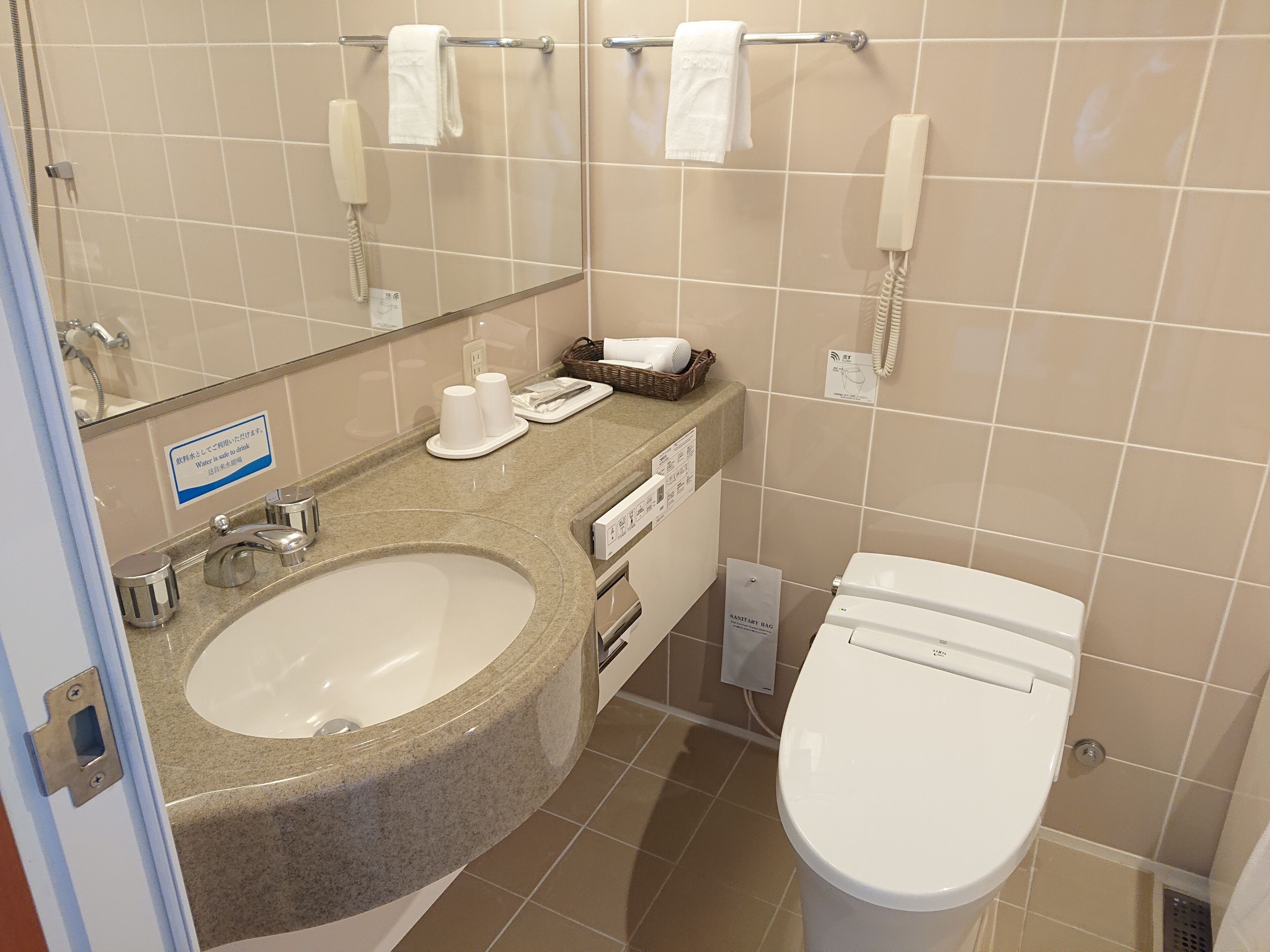 combined shower/bathtub, free toiletries, hair dryer, slippers