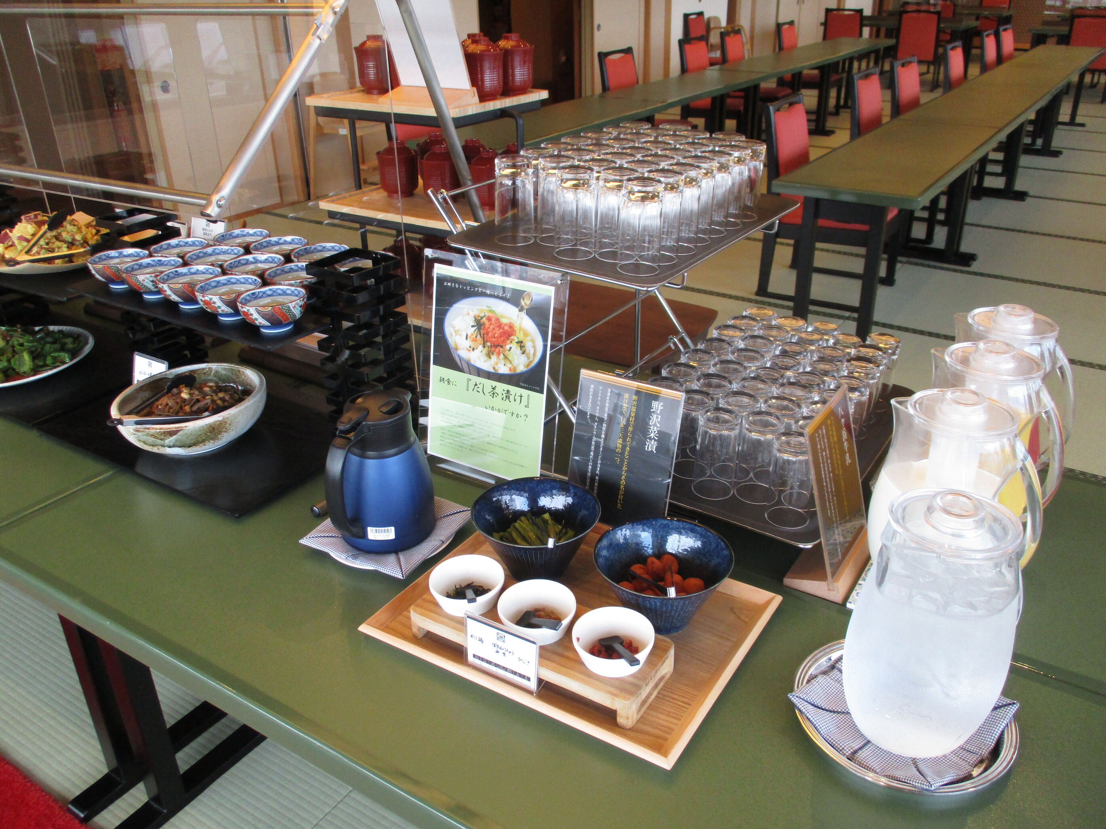 A buffet setup with various food items and beverages.