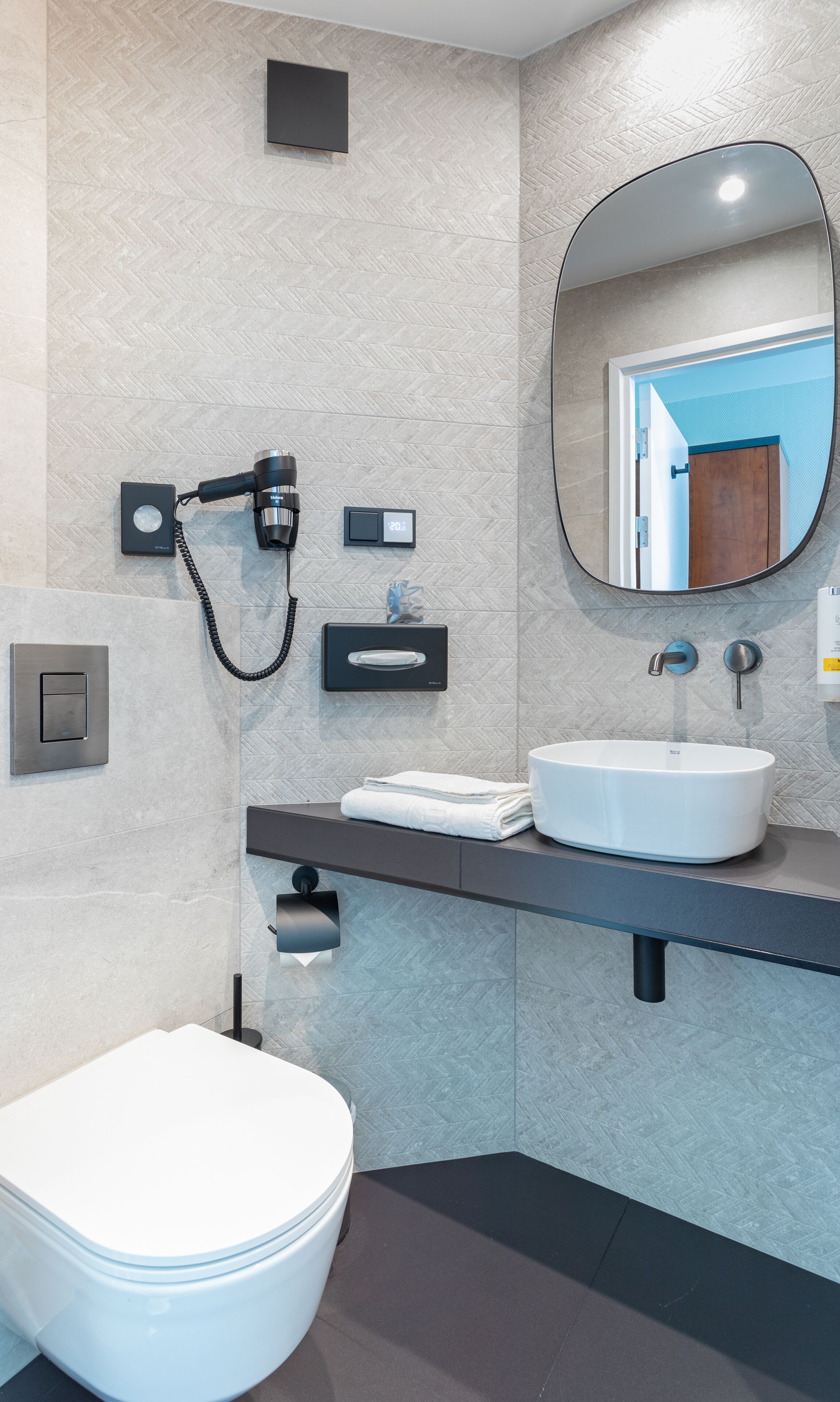 hair dryer, towels, soap, toilet paper