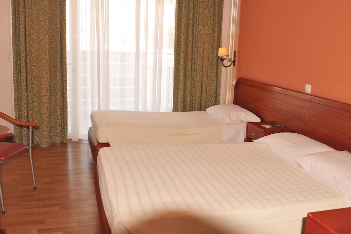 Triple Room | Desk, blackout curtains, free cots/infant beds, rollaway beds