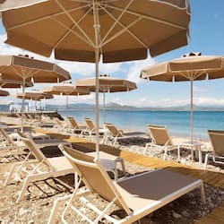 On the beach, sun loungers, beach umbrellas, beach towels