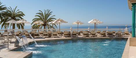 Indoor pool, outdoor pool, open 11:00 AM to 7:00 PM, pool umbrellas