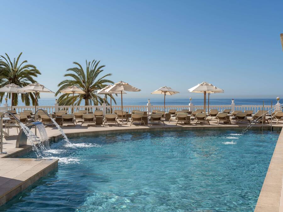 Indoor pool, outdoor pool, open 11:00 AM to 7:00 PM, pool umbrellas