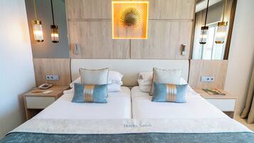 Seprai premium, selimut bulu angsa, minibar, dan brankas