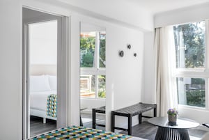 Family Suite | Living area | 40-inch TV with digital channels