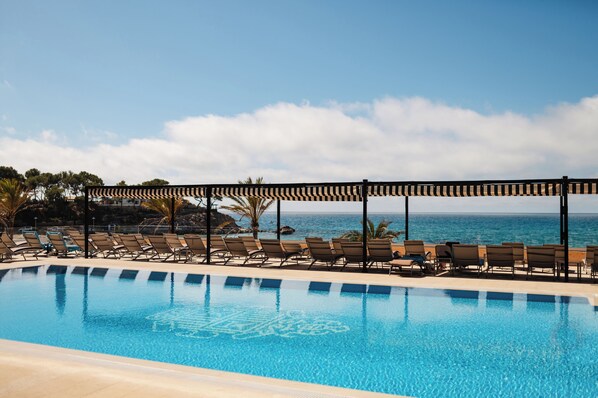 Indoor pool, outdoor pool, pool umbrellas, sun loungers