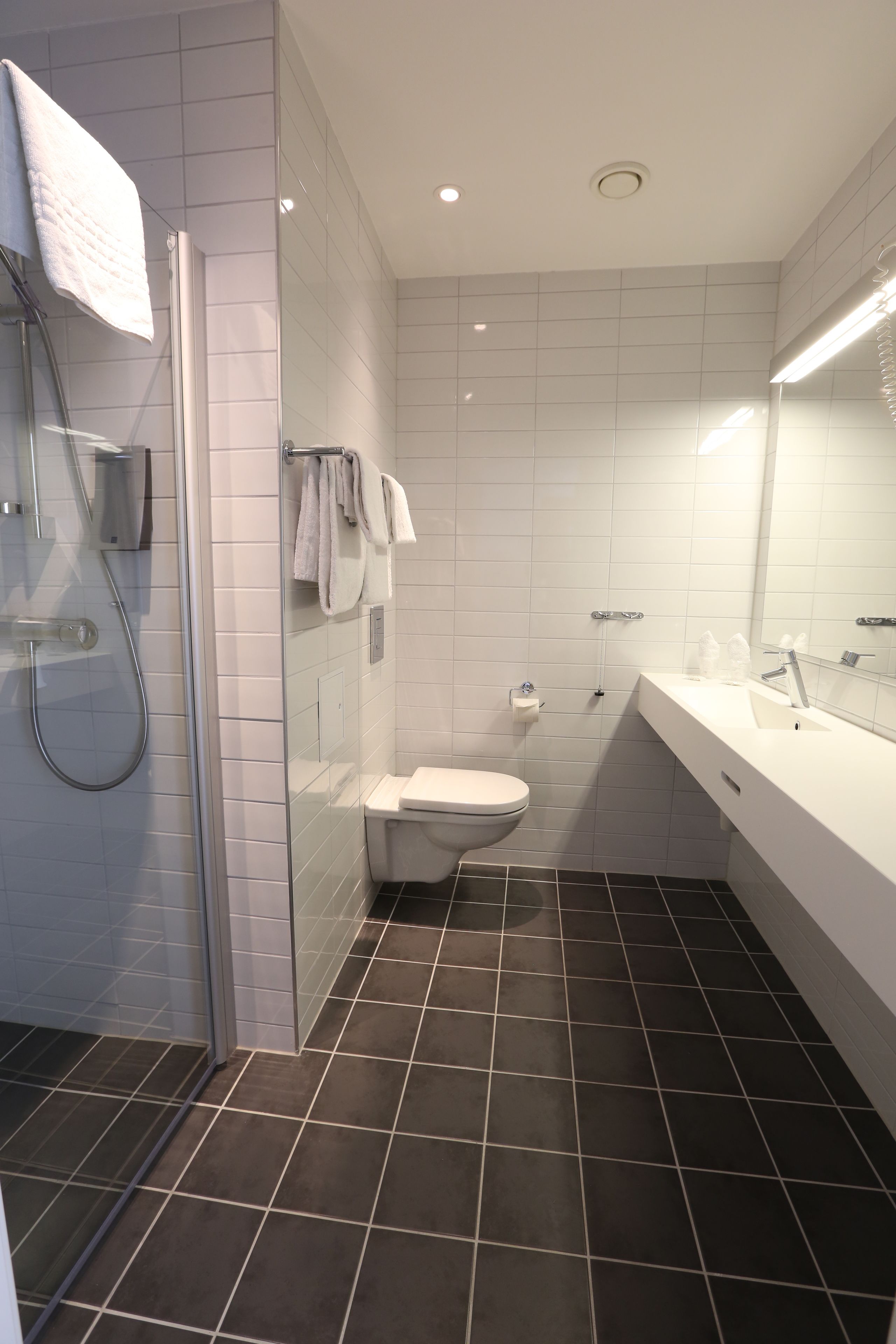 shower, hair dryer, heated floors, towels