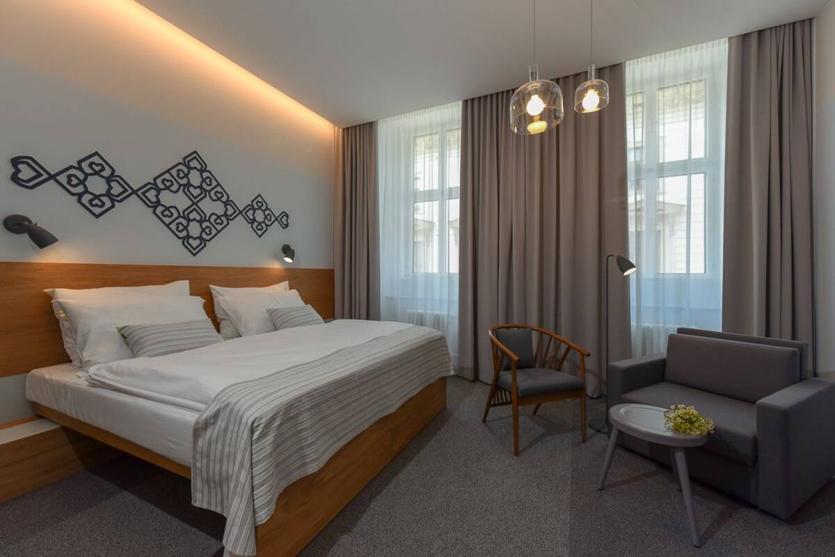 Deluxe Room, 1 Bedroom, City View, Corner | Minibar, in-room safe, desk, laptop workspace