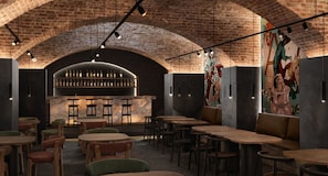 A restaurant interior with brick arches, a bar area, and seating arrangements. - Slavia (Brno)
