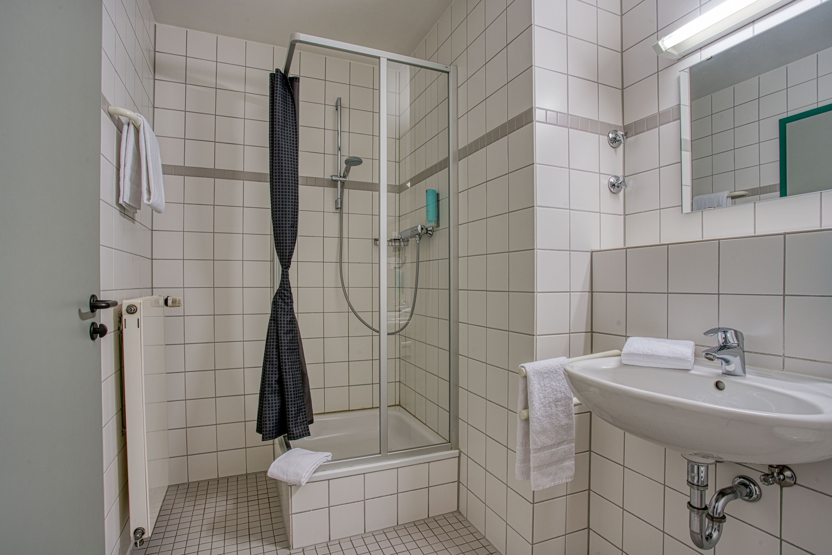 standard double room | bathroom | shower, rainfall showerhead, hair dryer, towels