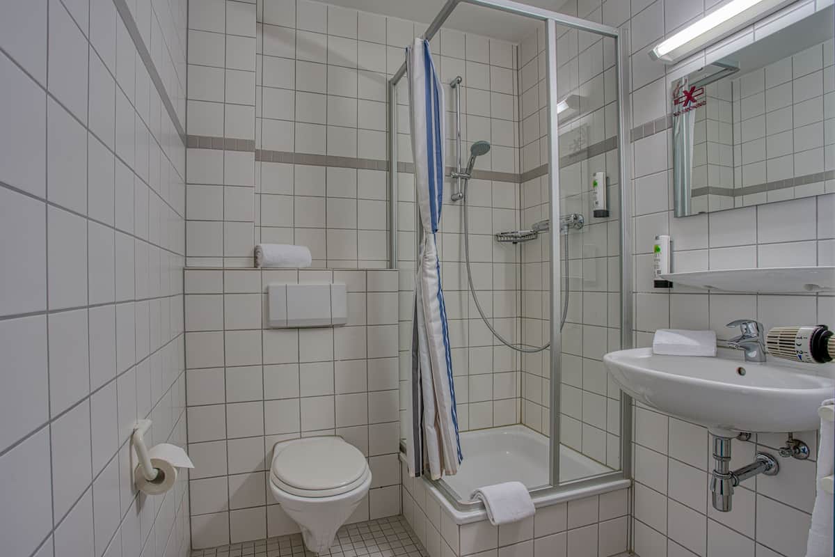 shower, rainfall showerhead, hair dryer, towels