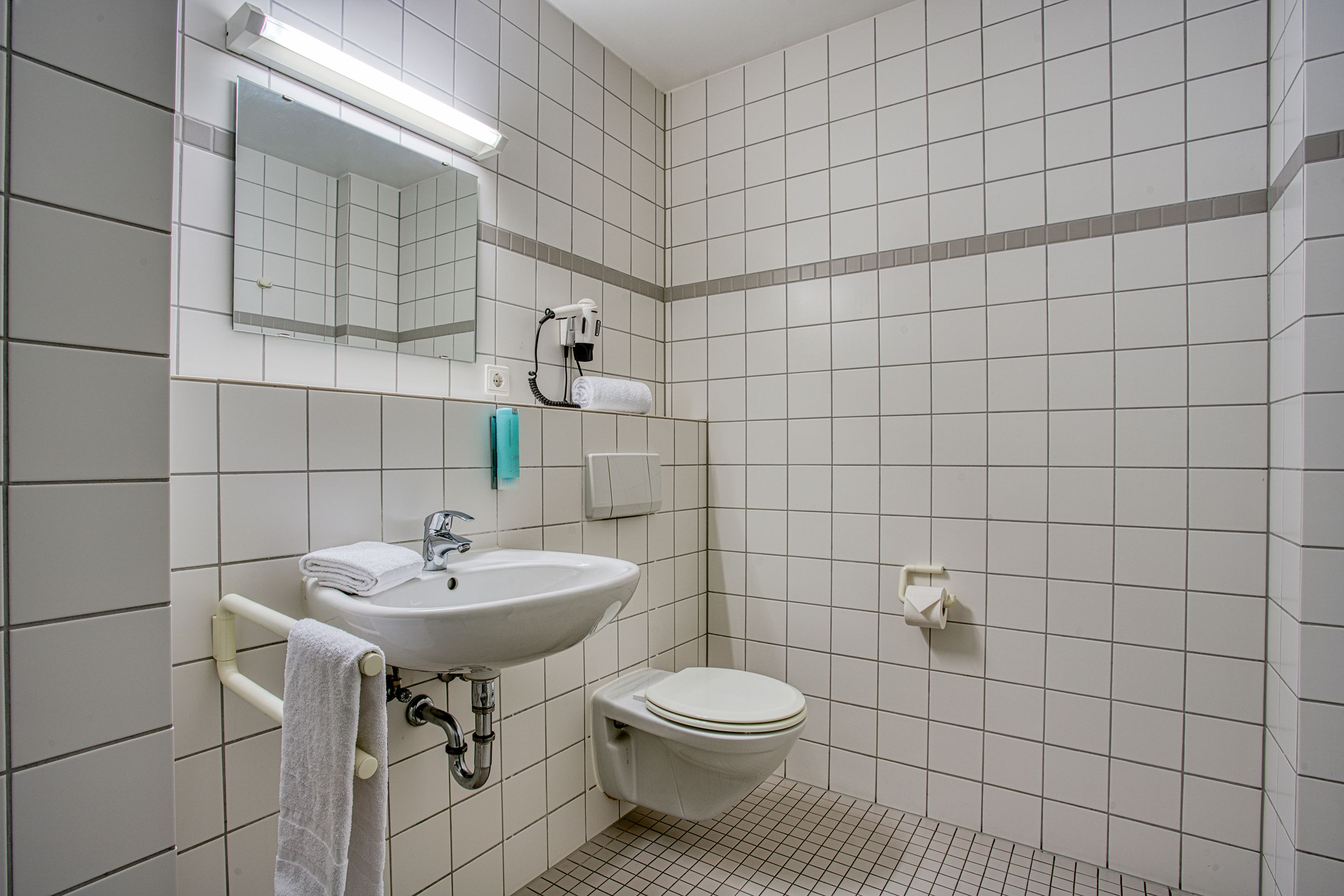 standard double room | bathroom | shower, rainfall showerhead, hair dryer, towels
