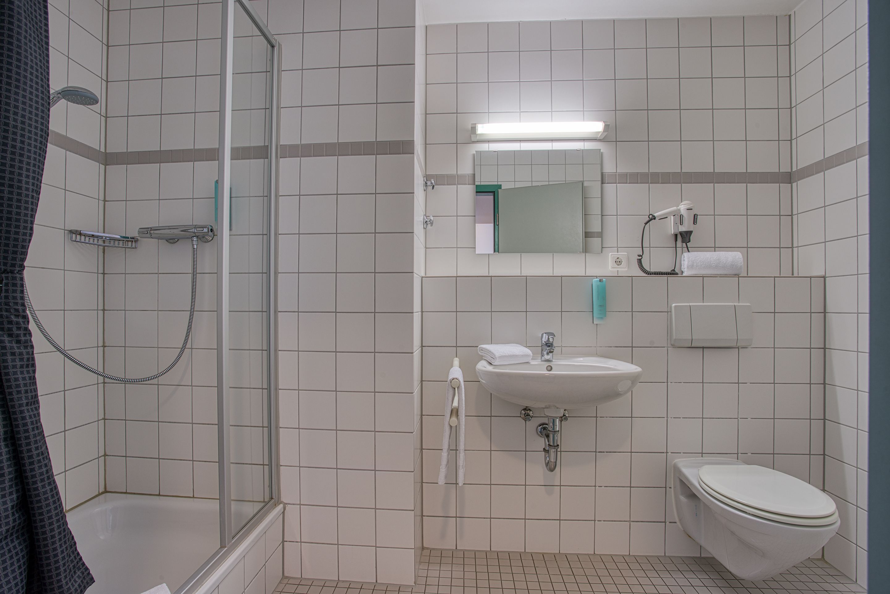 shower, rainfall showerhead, hair dryer, towels